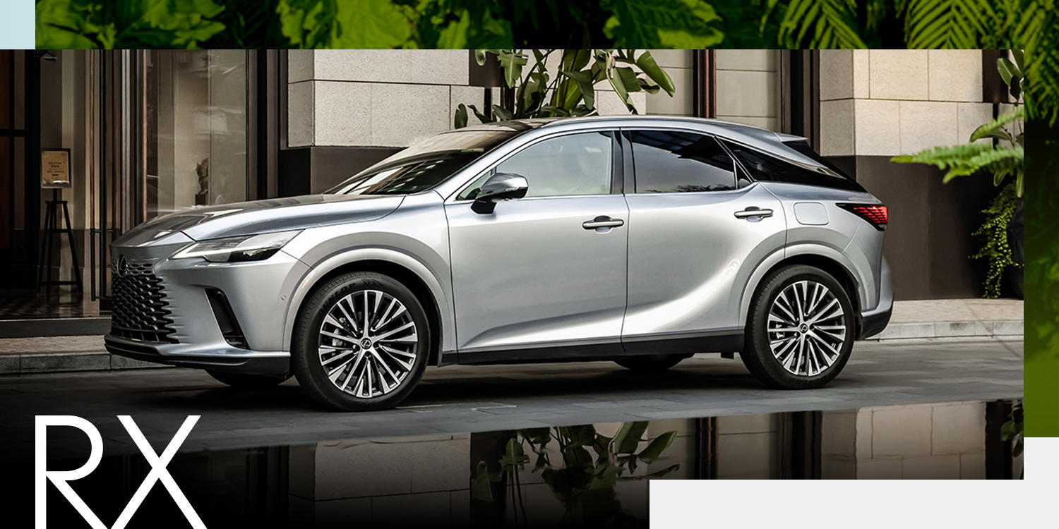 An RX is parked in front of a city building. Look closer at the RX.