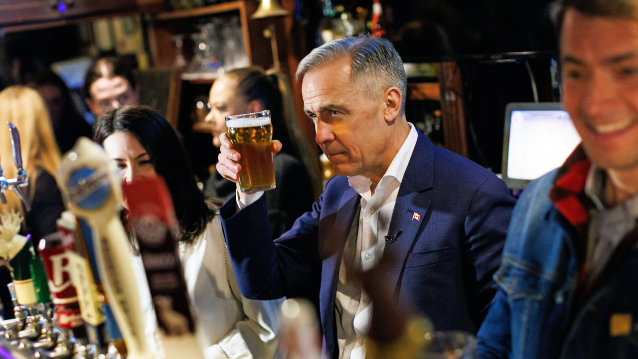 Liberal Party of Canada leader Mark Carney raises a pint 