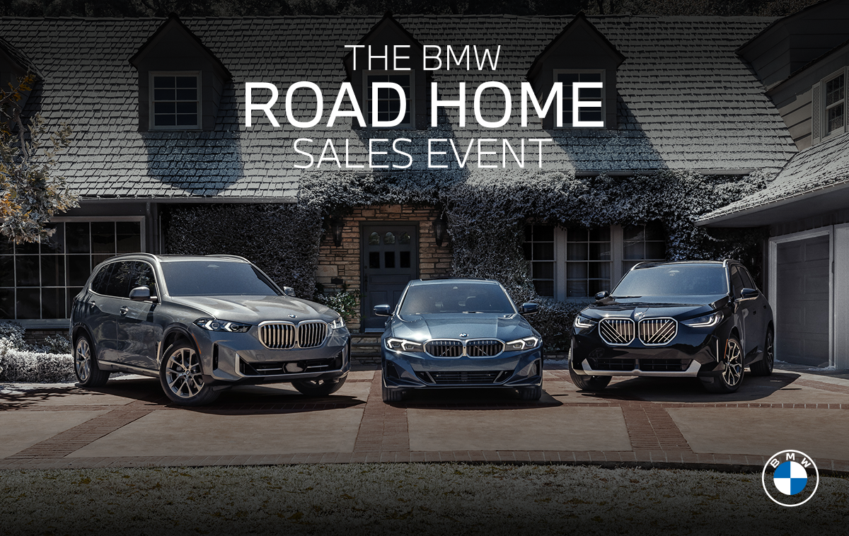 Three BMWs parked outside of a house covered in snow for The BMW Road Home Sales Event.