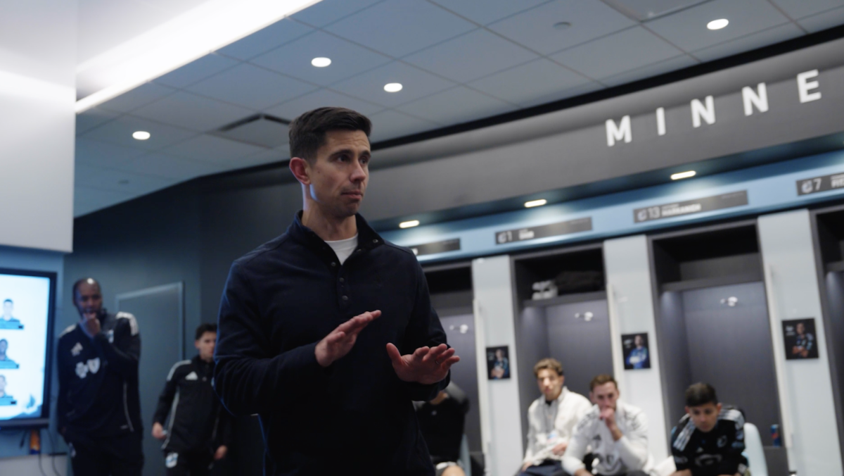 Coach Ramsay addresses the team in the locker room