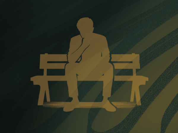 person sitting on bench alone