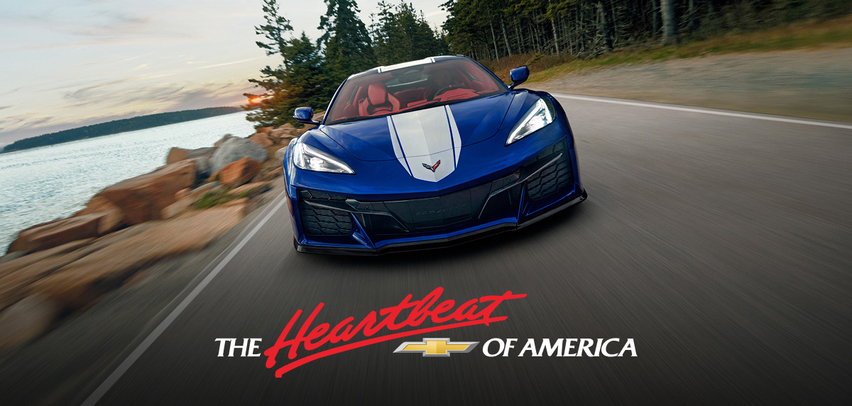 2027 Corvette Grand Sport driving down a coastal road.
