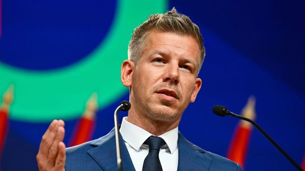 Peter Magyar gestures as he speaks to the media after defeating Prime Minister Viktor Orban's party in the country's parliamentary elections.