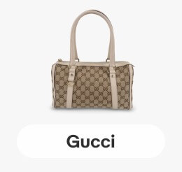 A brown Gucci GG Canvas Abbey Boston Handbag.