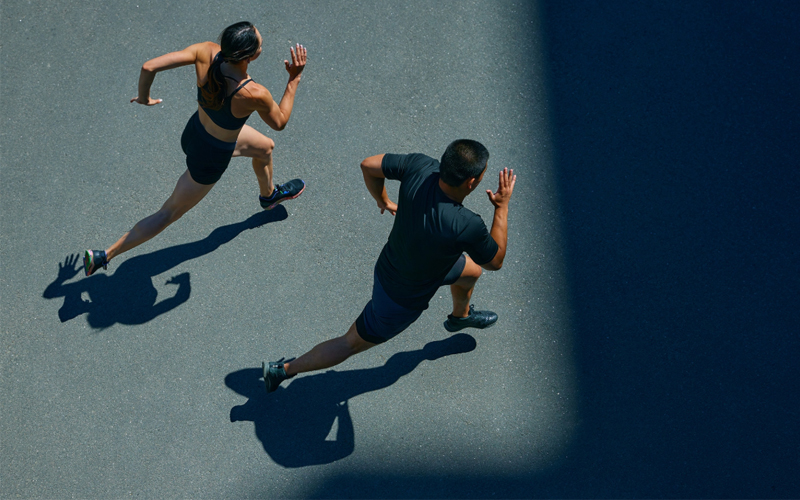A woman and a man running