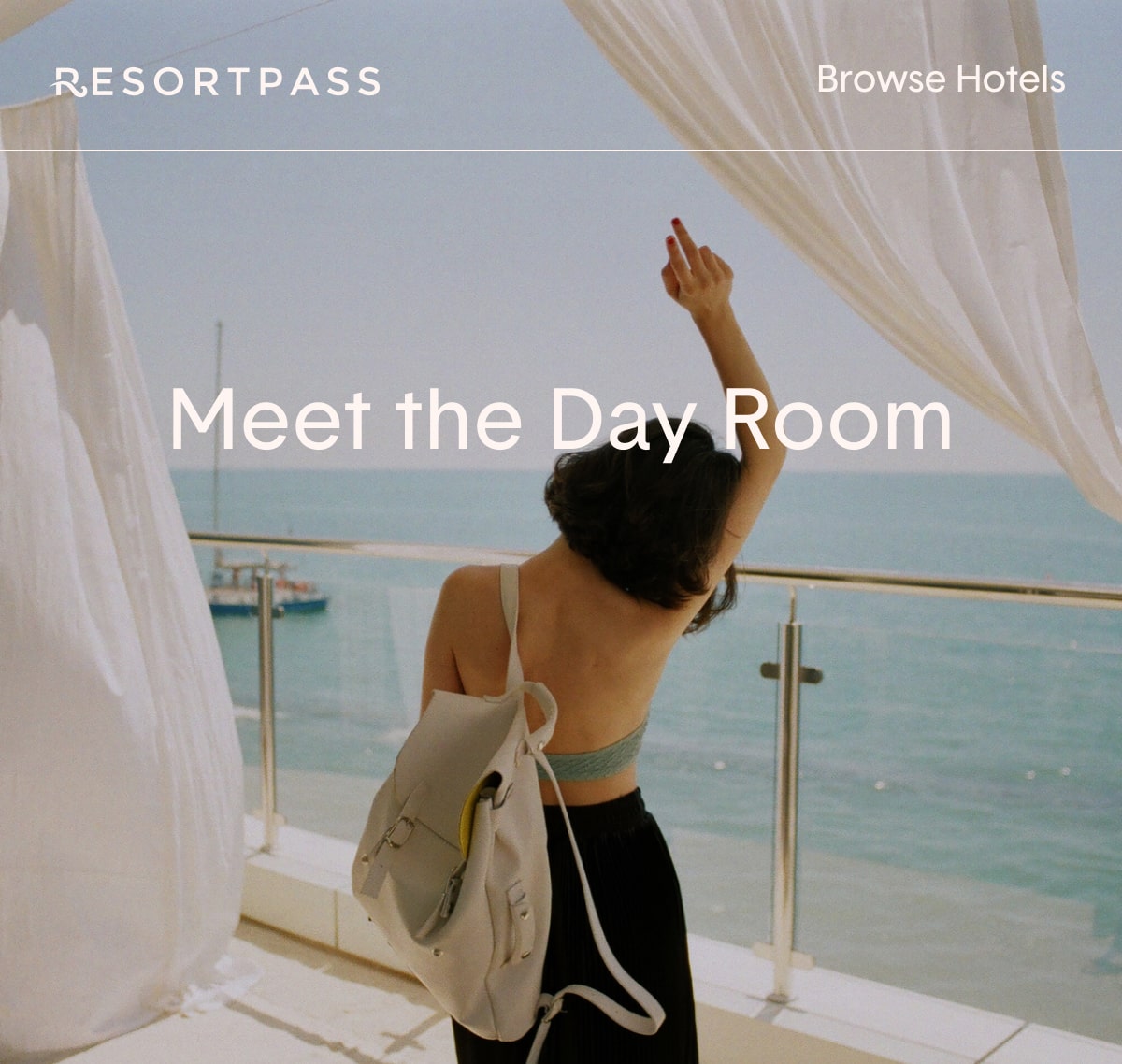 Carefree girl enjoying a hotel day room balcony