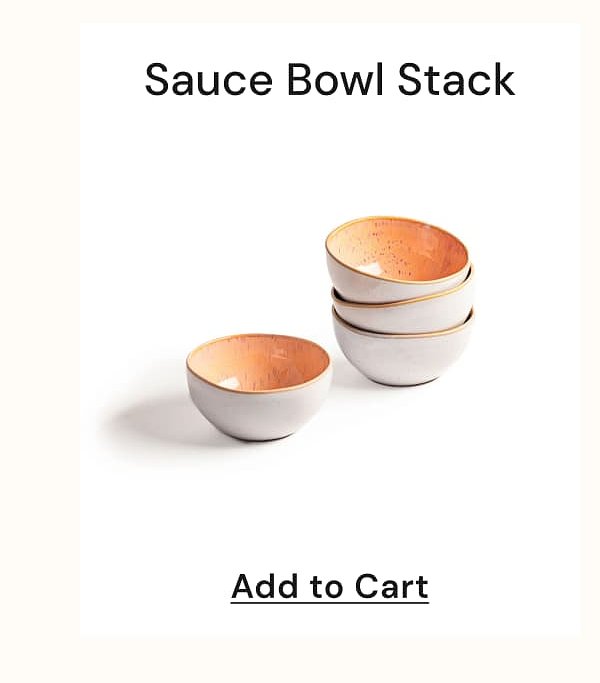 Three stacked sauce bowls with a white exterior and a copper interior.