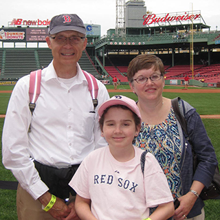 Erica Leafquist with her father Eric (left) and mother Kathy (right) at Fenway Park, 2013.