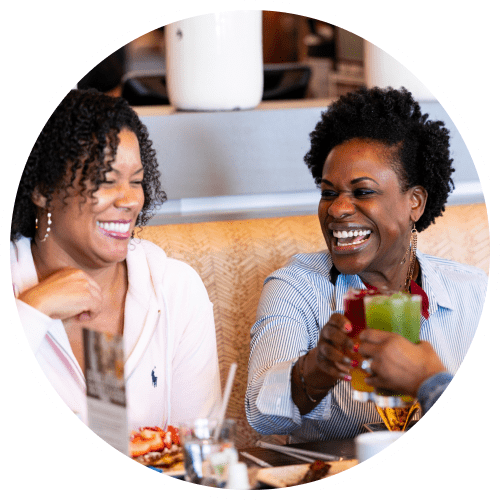 Customers laughing during brunch