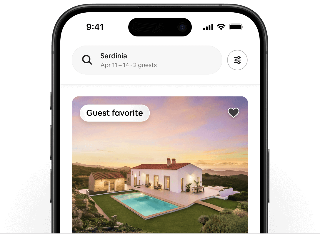 A phone shows an Airbnb listing of a white house in Sardinia. In the top-left corner of the listing is a Guest Favorite badge.