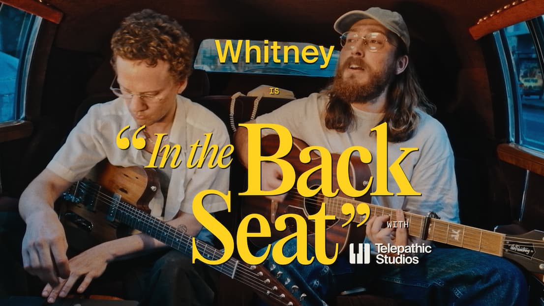 Whitney perform in the back seat of a limo.