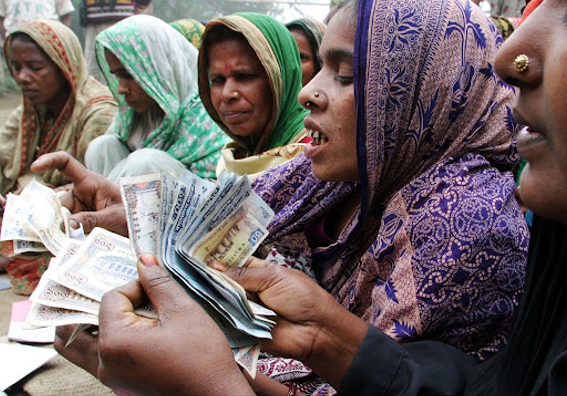 A Bangladeshi woman handles cash