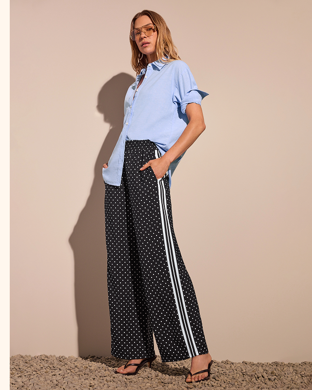 asy, breezy, and endlessly versatile. The Dottie Track Pant pairs a playful dotted print with a relaxed wide-leg fit for effortless style from day to night.
