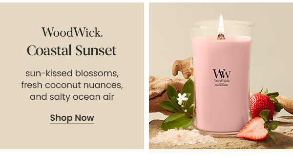 WoodWick Coastal Sunset candle with text describing scent notes, slices of strawberry, flowers, salt crystals, and a Shop Now button.