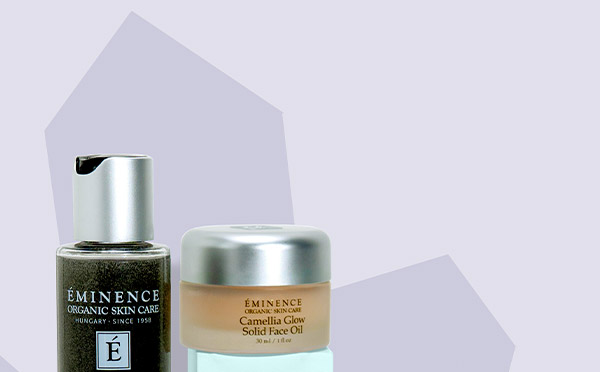 Eminence Organics Gemstone Collection stacked next to gems and stones