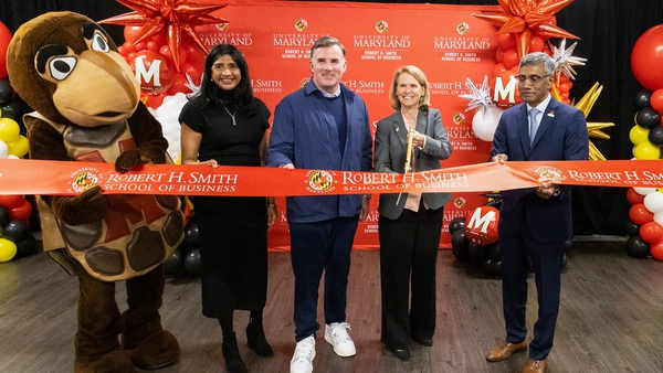 Testudo and four others cut red Robert H. Smith School of Business-branded ribbon