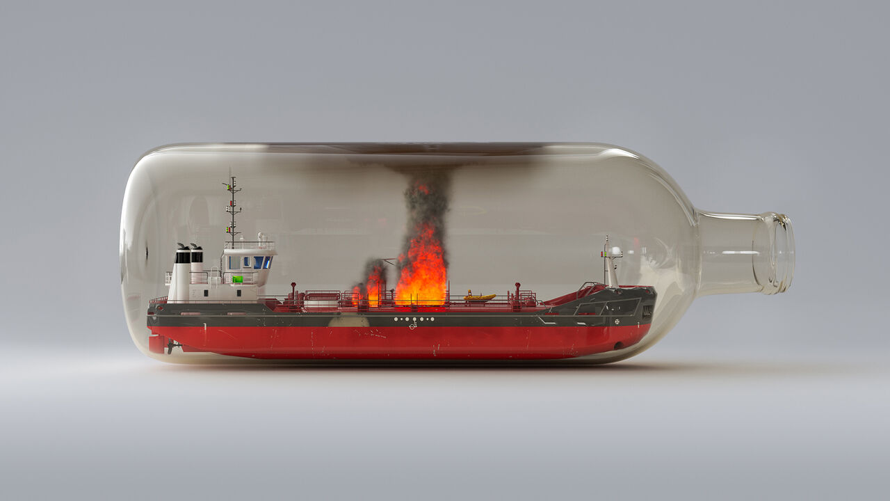 An oil tanker trapped inside a glass bottle.