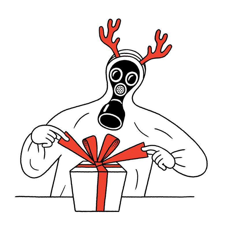 Person in a hazmat suit wrapping a present.