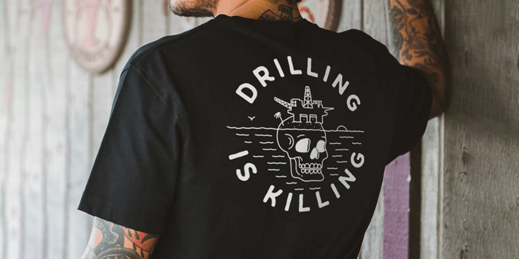 A black t-shirt that reads "Drilling is Killing"