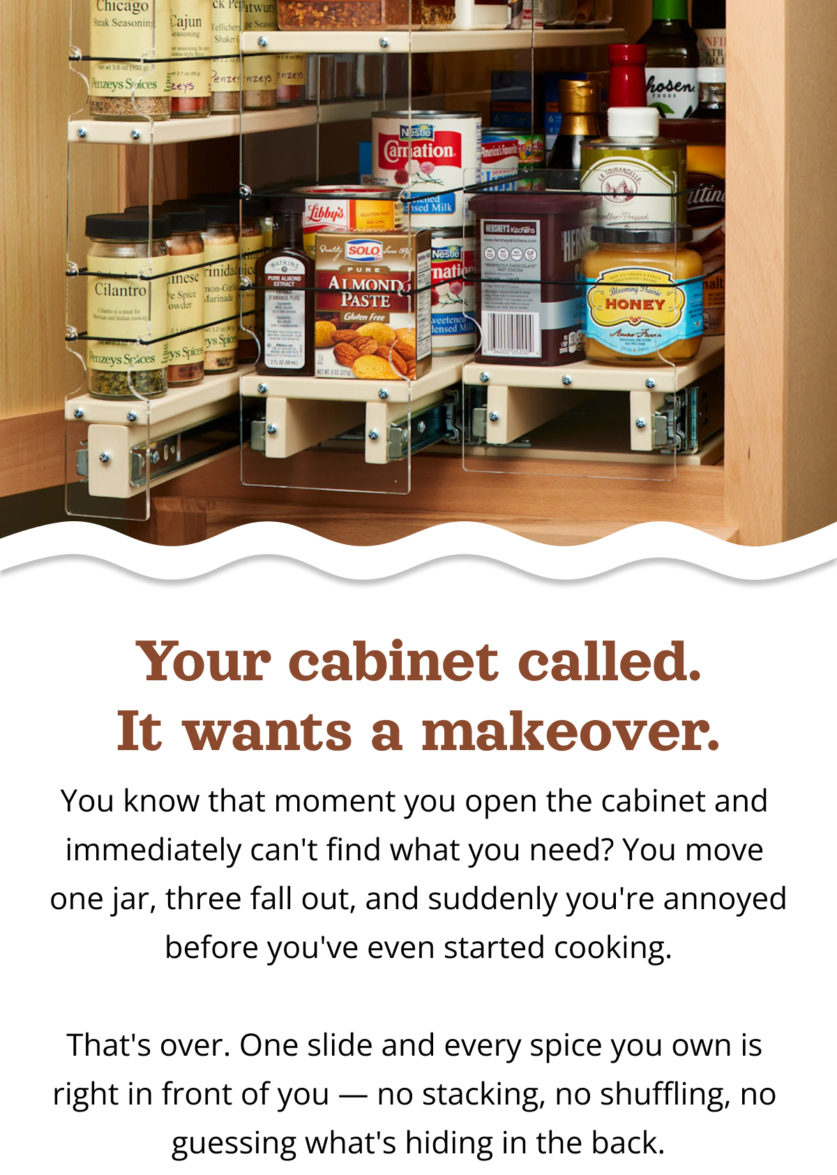Vertical Spice pull-out spice rack drawer fully extended with multiple tiers holding spices, oils, and pantry items