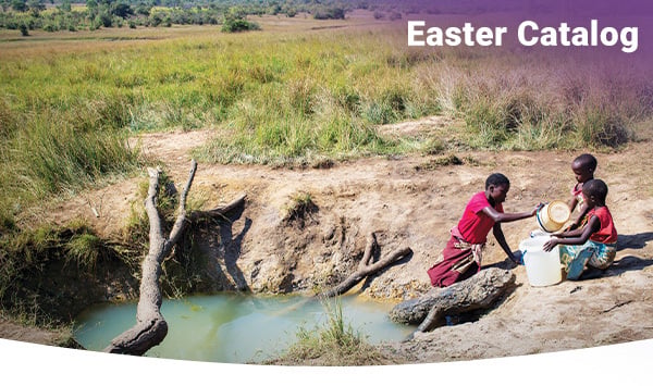 Girls collect dirty water from a hand-dug pit.