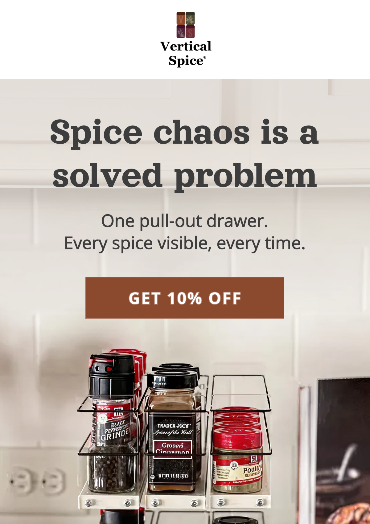Pull-out spice rack drawer organizing multiple spice jars in a kitchen cabinet under the headline “Spice chaos is a solved problem”.