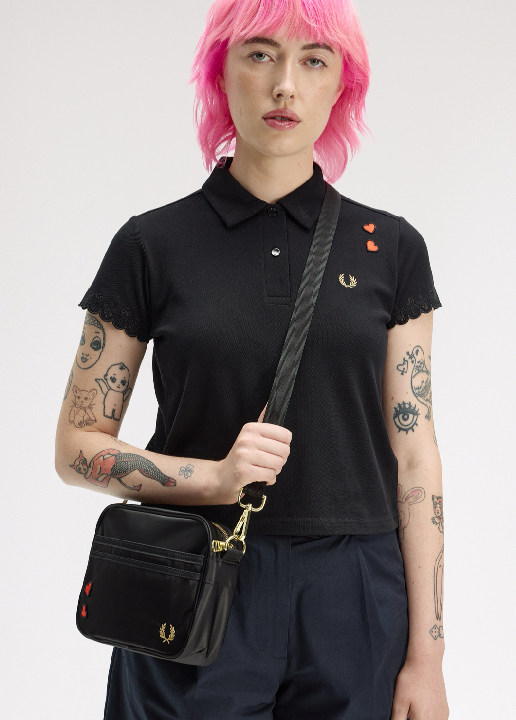 Women's messenger bag and black polo shirt from the Amy Winehouse collection