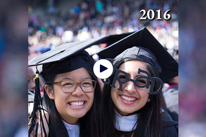 Two Penn graduates with caps and graduation classes in 2016. 