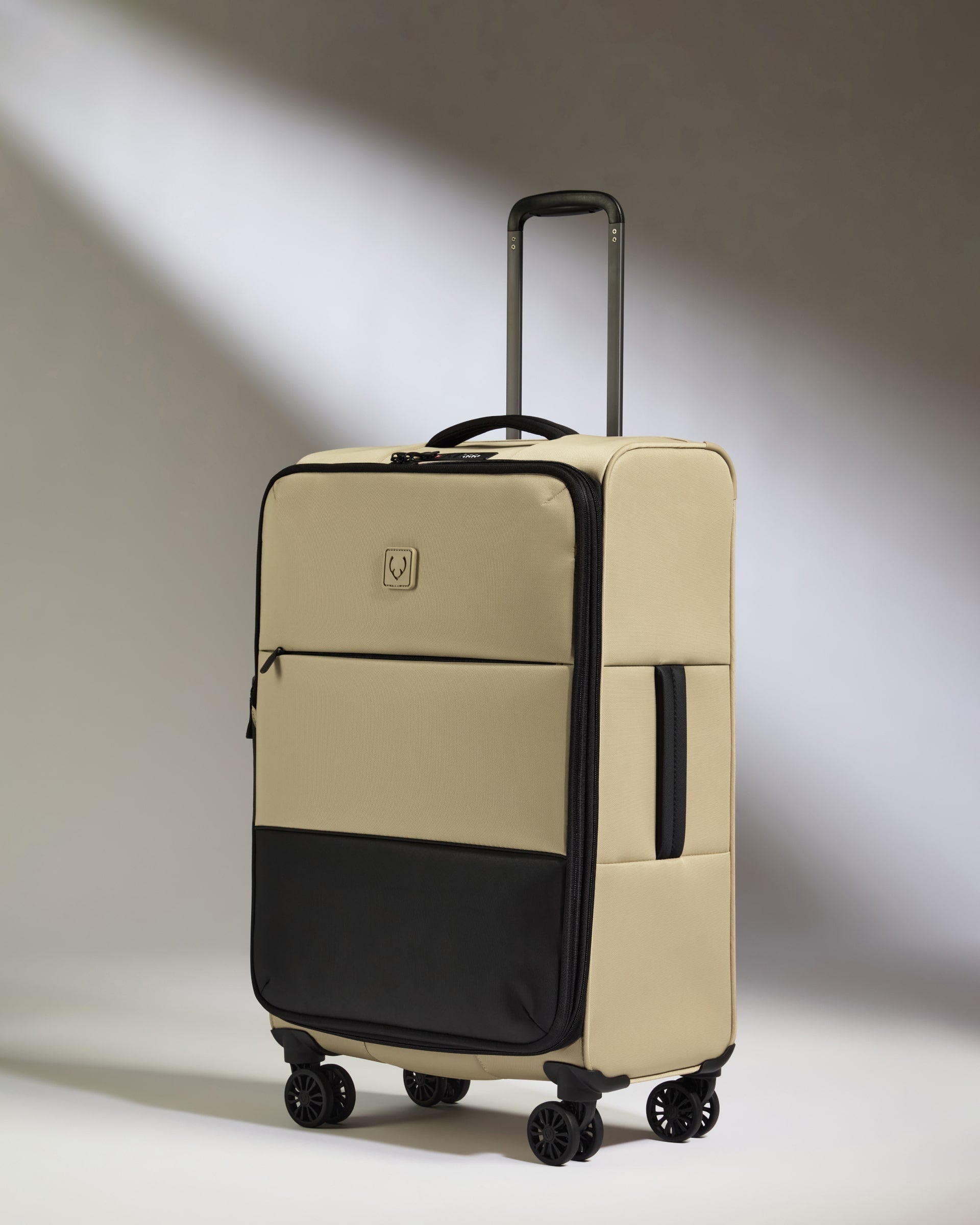 Image of Lightest Medium Luggage in Sand - Soft Stripe 2.0