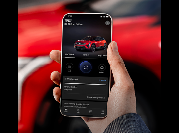 Hand holding phone displaying the myCadillac Mobile App