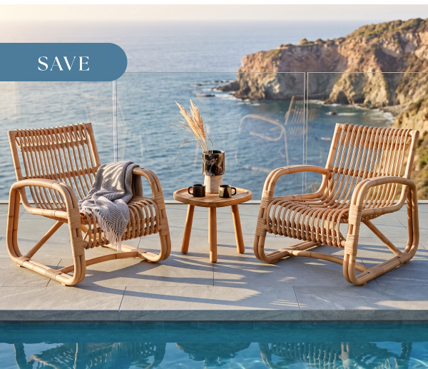 Cane-line Royal Curve lounge set on a relaxing outdoor patio