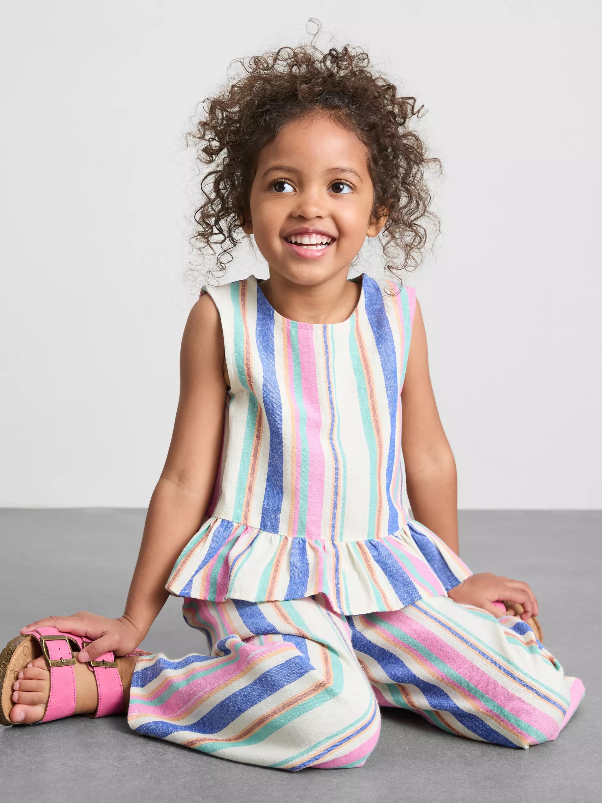 Girl wearing a  Stripe Peplum Blouse