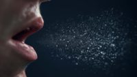 closeup of mouth coughing