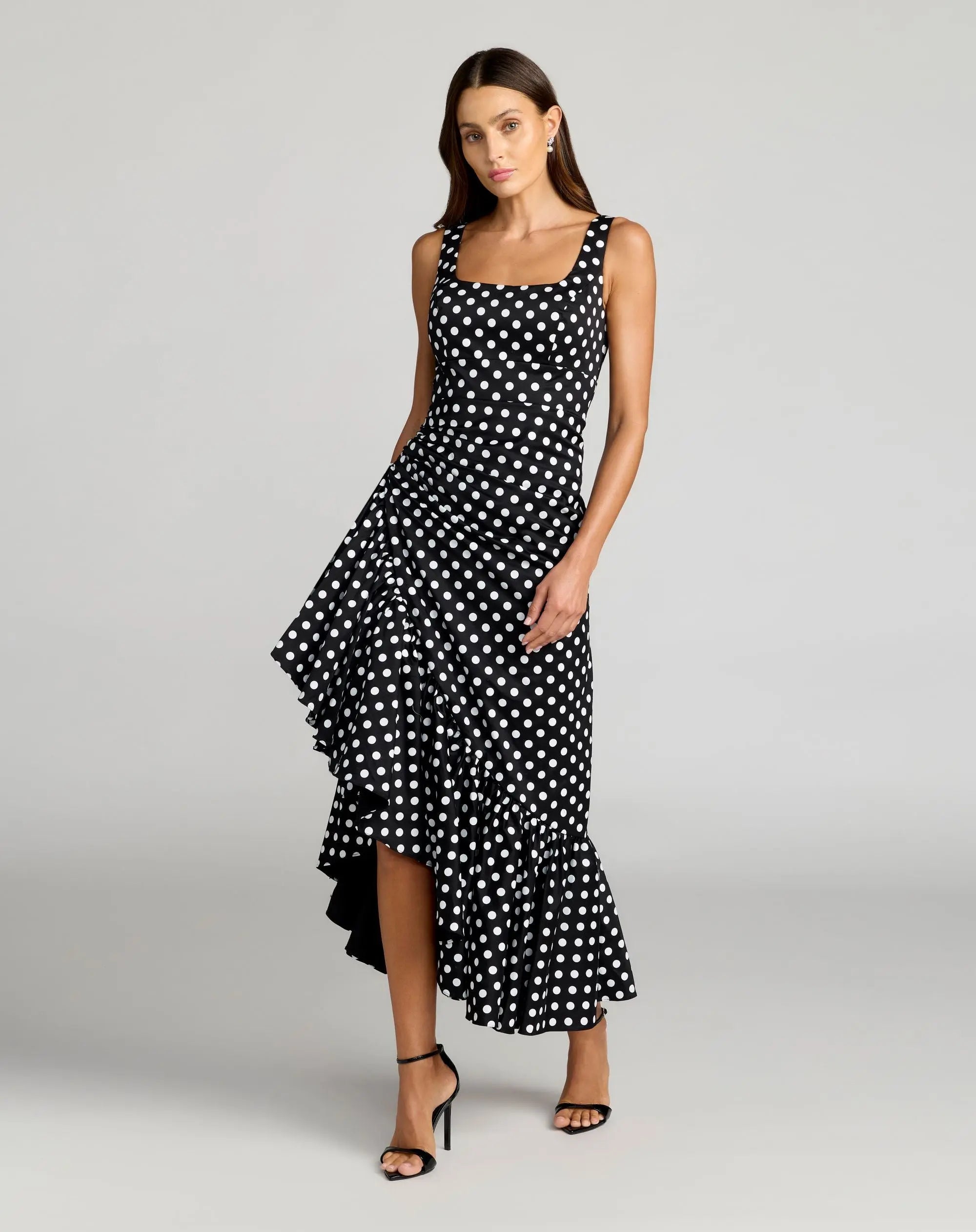 Image of Black Sleeveless Polka Dot Midi Dress With Ruffled Hem