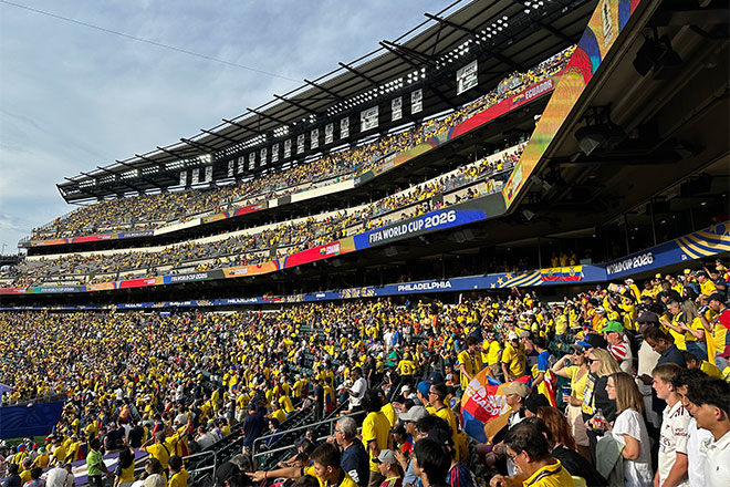A crowded soccer stadium watching a FIFA World Cup game.