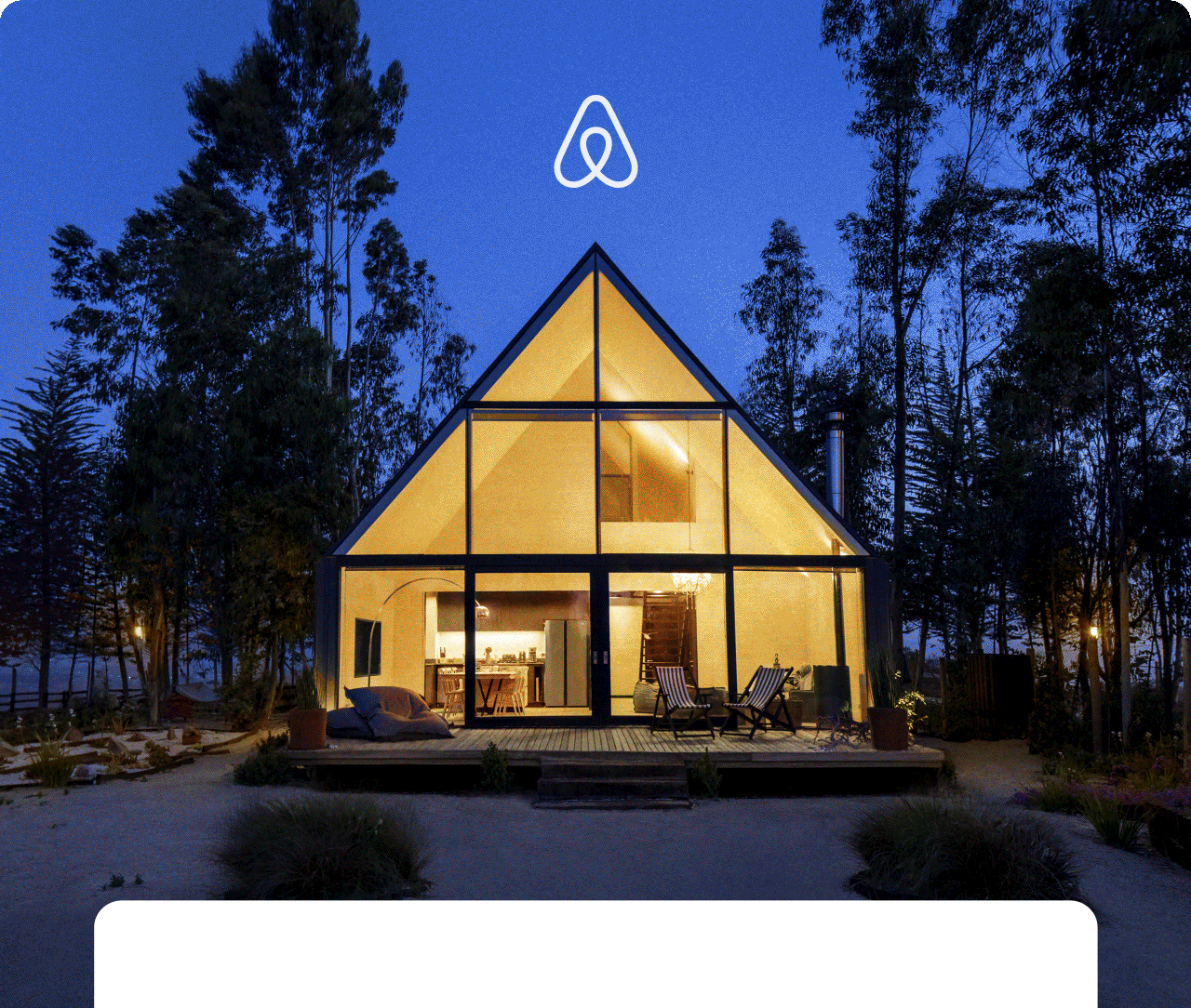 The Airbnb logo sits at the top of an animated gif that cycles through homes in unique places. First, a modern cabin with glass walls glows warmly against the night sky. Next, an aluminum travel trailer catches the light of the setting sun in a desert. Then a green, grassy hill blankets two peaked eaves covering the windows of an underground home. After that, a tiny house sits in a wandering field that leads to snow-capped mountains. Cut to a modern, angular home with a calm, blue pool. And finally, a hanok with a sweeping black roof and natural wood tones under an evening sky.