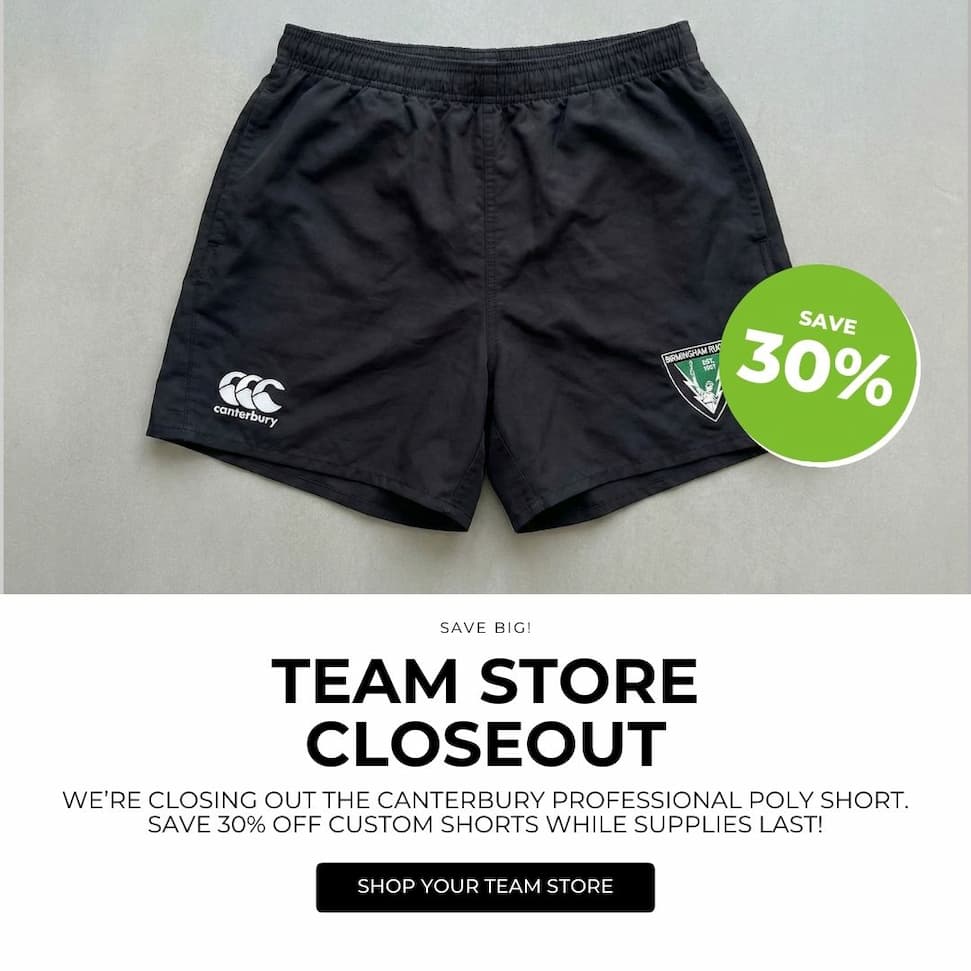 an image of a black shorts with a green tag on it