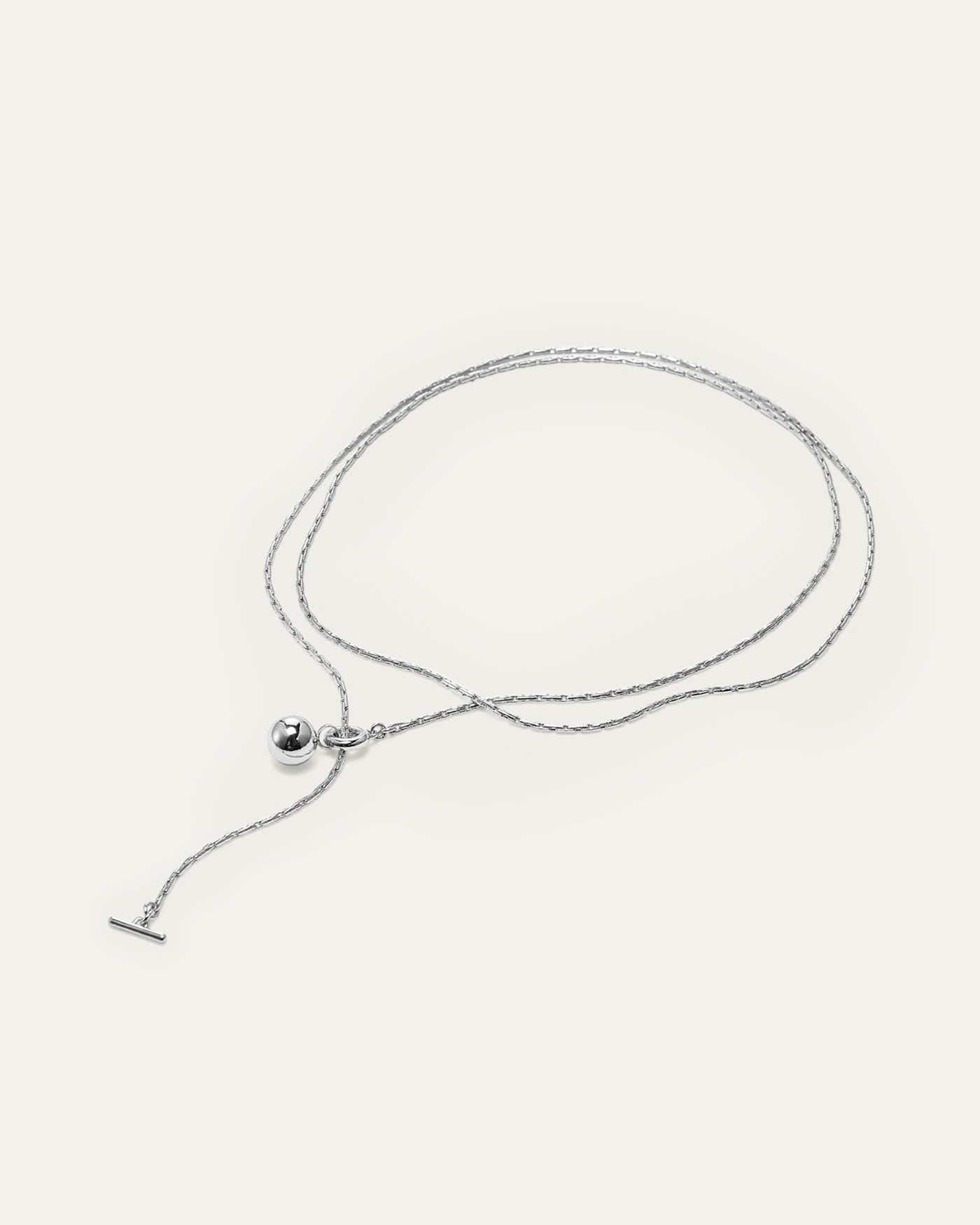 An intricate round chain with unique light-catching qualities and limitless ways to wear. This piece can be worn fully extended, double wrapped, as a ...