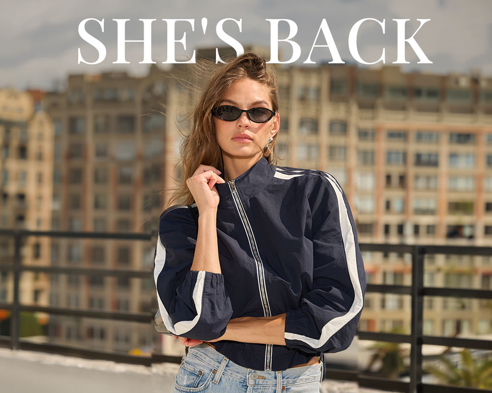 Text overlay "She's back" on image