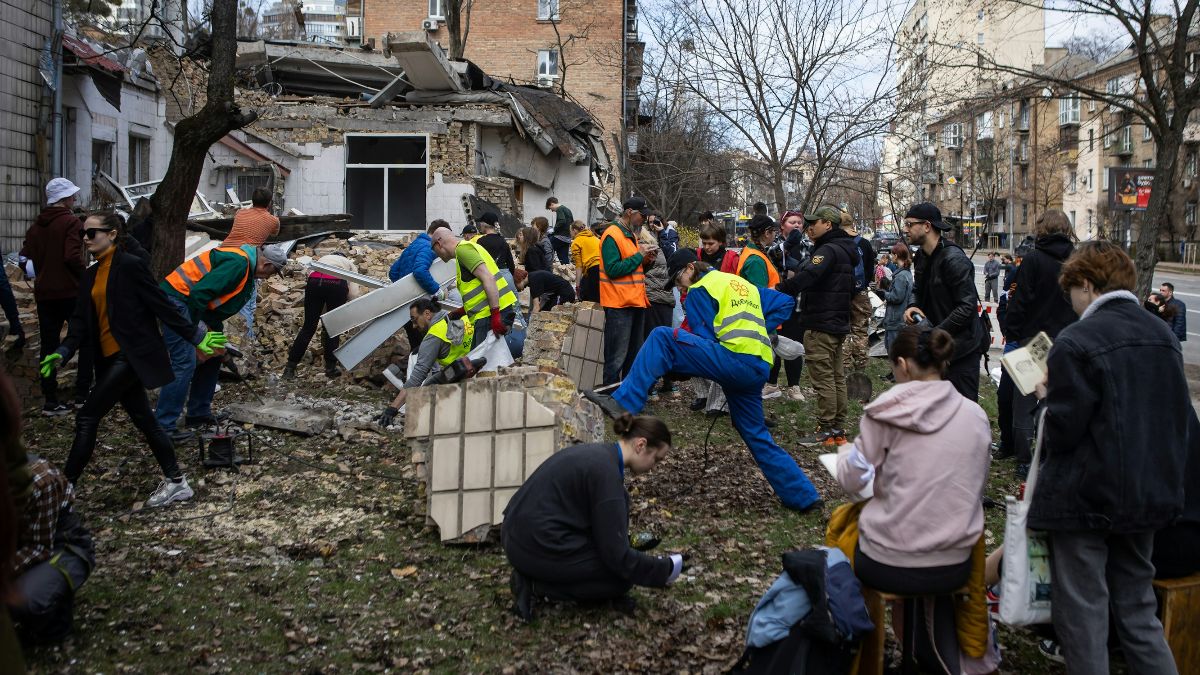 Volunteers cleaning up outdoor debris