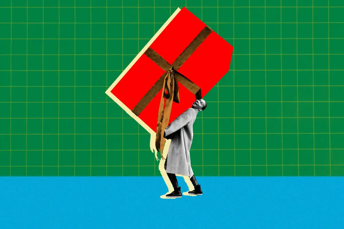 Man carrying a very large red gift box