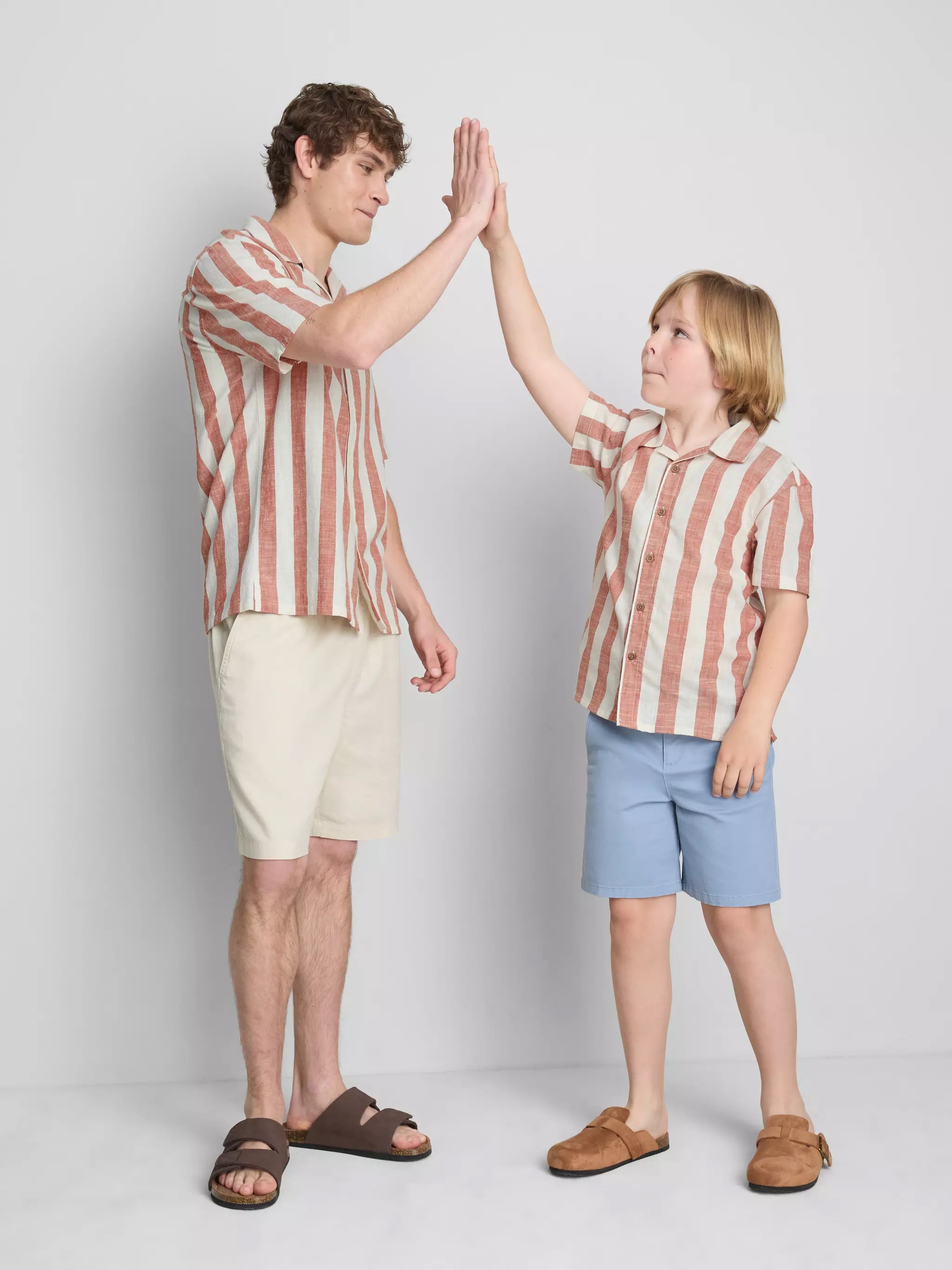 Man and a boy wearing a Stripe Shirt in red