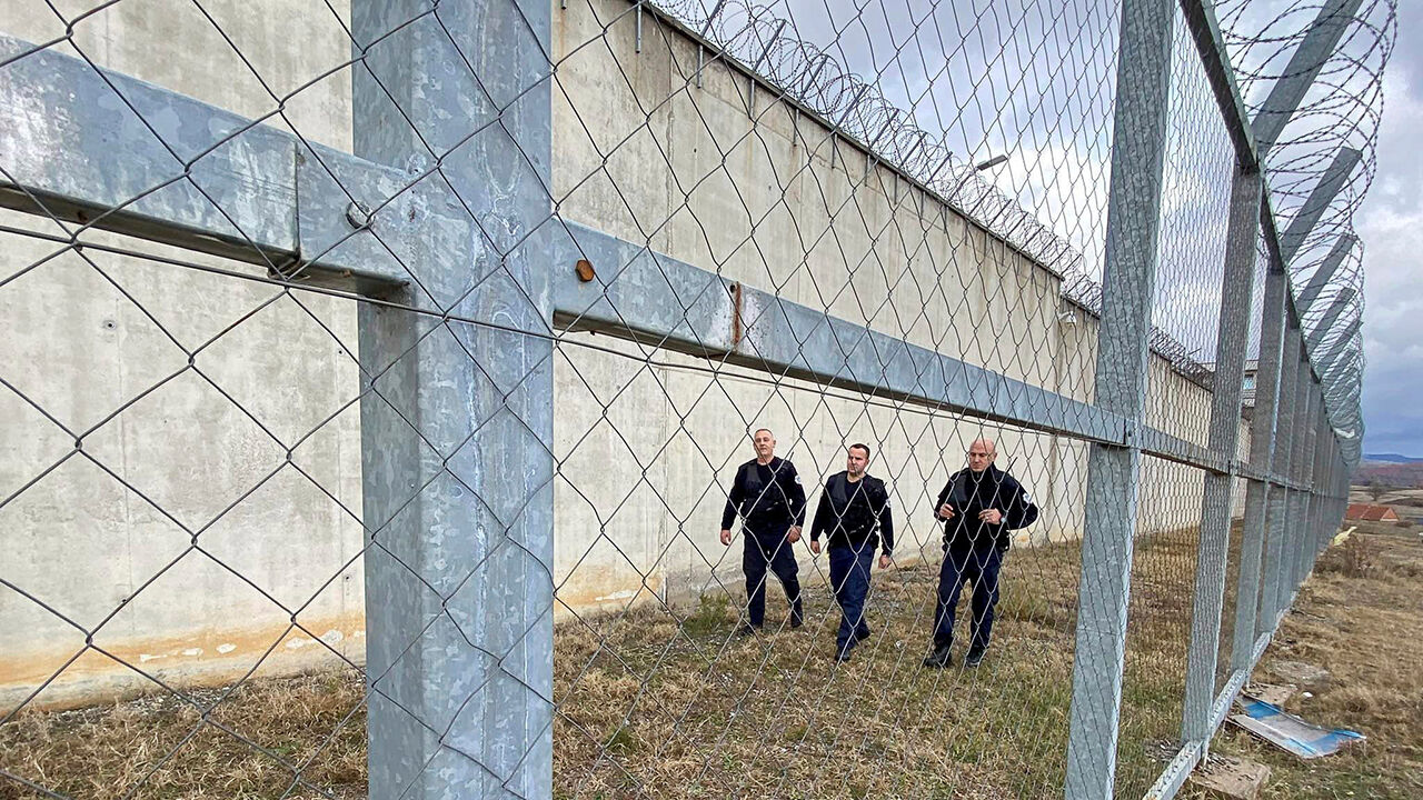 Kosovo prison guards inspect the fence of the 300-cell prison in Gjilan, Kosovo