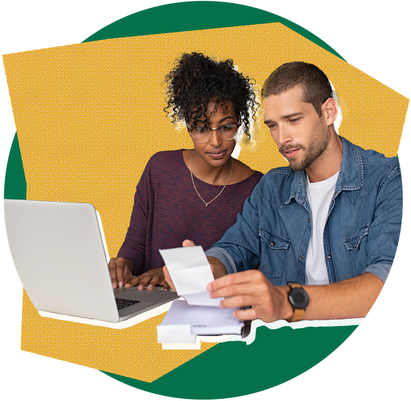 Man and woman sitting at a laptop working on bills