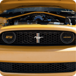 A yellow Ford Mustang&reg; vehicle with its hood popped