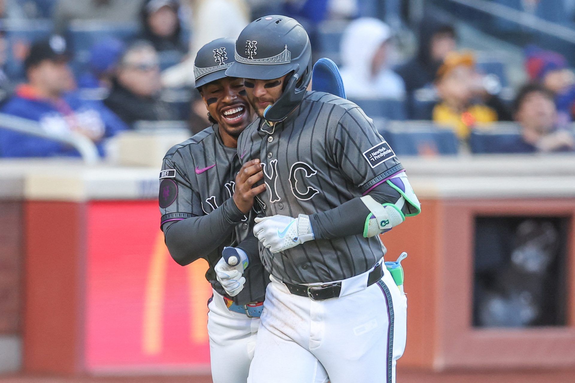 Apr 11, 2026; New York City, New York, USA; New York Mets third baseman Bo Bichette (19) is greeted by shortstop Francisco Lindor (12) after hitting a two-run home run in the fifth inning against the Athletics at Citi Field.