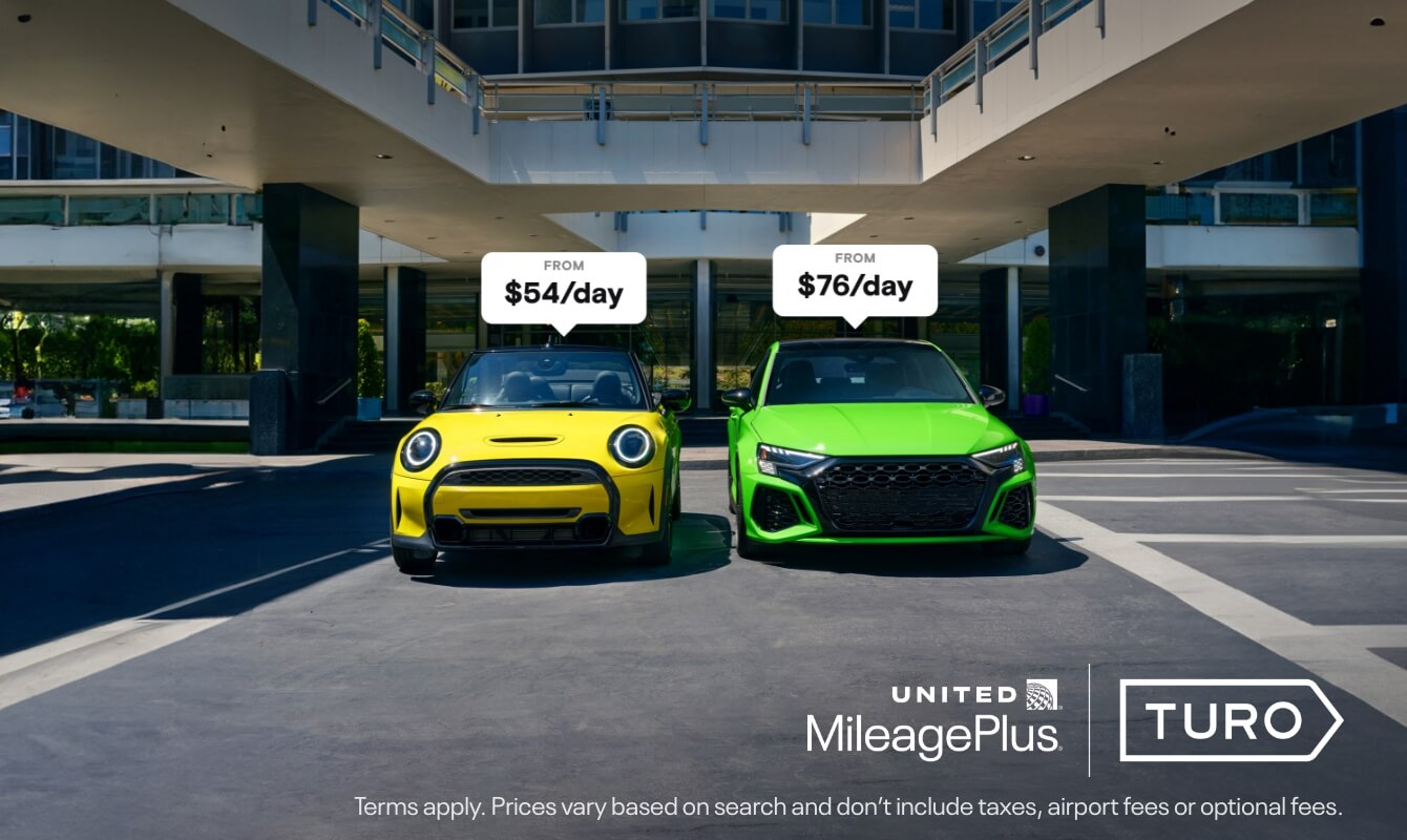 A yellow and green car side by side.