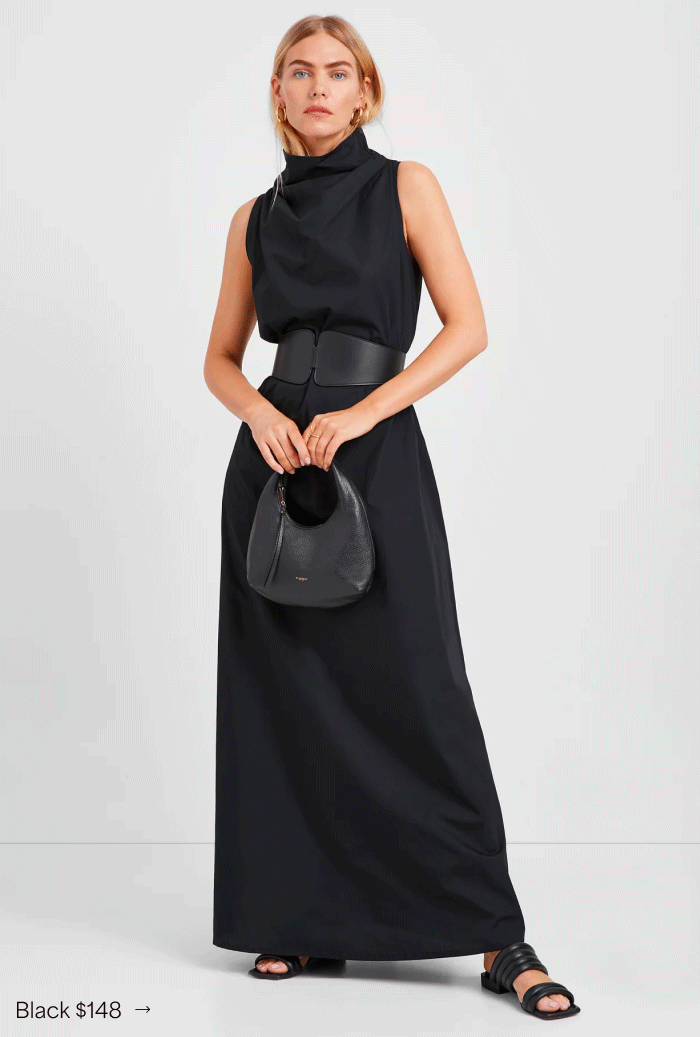 Maritza wears the Minna Sleeveless Dress with a wide belt and holds a small black bag, labeled “Black $148.”