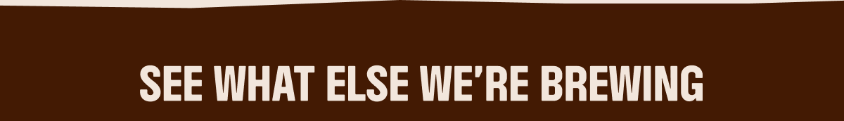 an image of a brown and white sign with a sky background