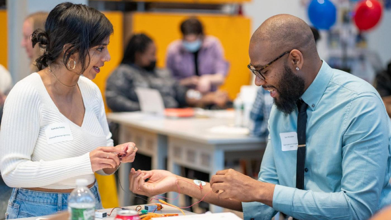 During a seminar on how the brain controls movement, Ramsha Farooq (left) and Sean McFadden (right) practiced a brain-machine interface activity. (Photo by Steve Myaskovsky)